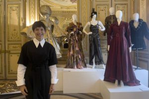 Silvina Vicente junto a varios vestidos del teatro argentino que se ensenan en la exposicion Coleccion Tesoro. EFE M Soto